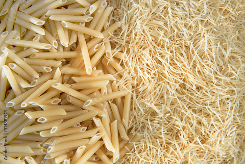 pasta feathers and filini as a culinary background photo