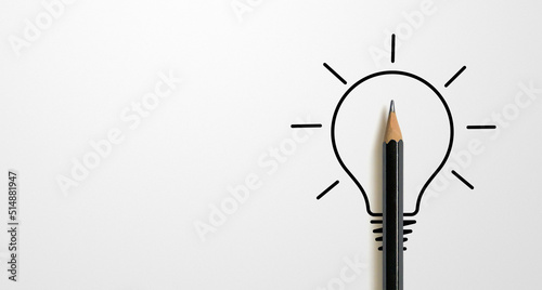 Black colour pencil with outline light bulb and word idea on white paper background. Creativity inspiration ideas concept photo