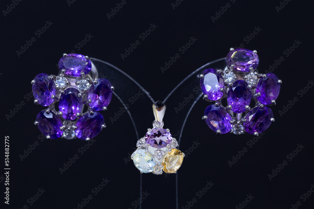 Women's earrings and accessories that has been decorated on a black screen Women's earrings and accessories that has been decorated on a black screen