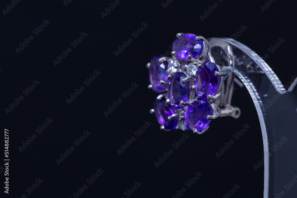 Women's earrings and accessories that has been decorated on a black screen Women's earrings and accessories that has been decorated on a black screen