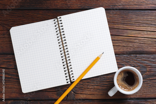 Notepad with pencil and coffee