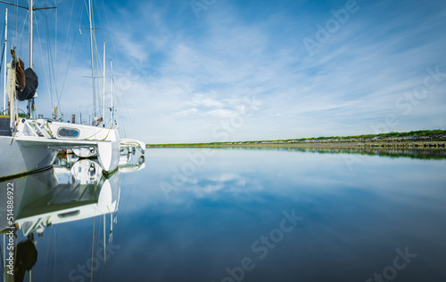 Photos Beautiful seascape and sailing catamaran in the blue sky at the background