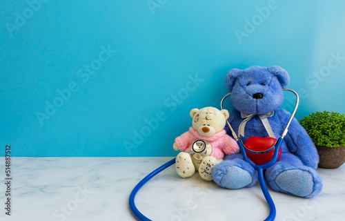 Children doctor concept - Teddy Bear with stethoscope. copy space