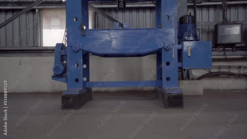 Industrial Equipment Hydraulic Power Press Machine In The Warehouse Of Dolvi Port In Maharashtra, India. close up, ascending shot Industrial Equipment Hydraulic Power Press Machine In The Warehouse Of Dolvi Port In Maharashtra, India. close up, ascending shot