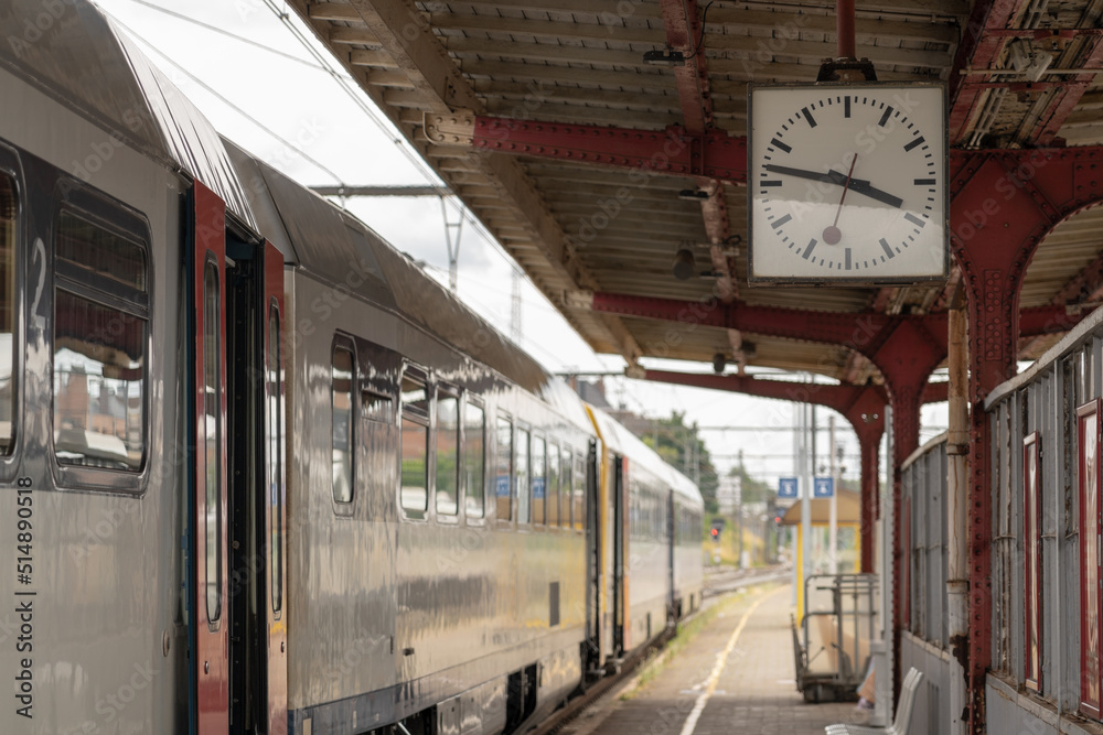 Fototapeta premium time flies by at the station with a waiting train