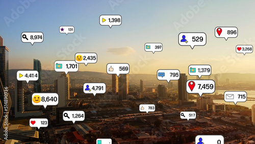 Social media icons fly over city downtown showing people engagement connection through social network application platform . Concept for online community and social media marketing strategy . High