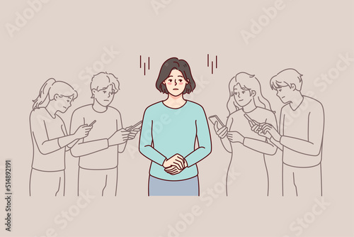 Young woman in people crowd using cellphone feeling lonely and isolated. Unhappy frustrated female separated from group with smartphones. Gadget addiction. Vector illustration. 
