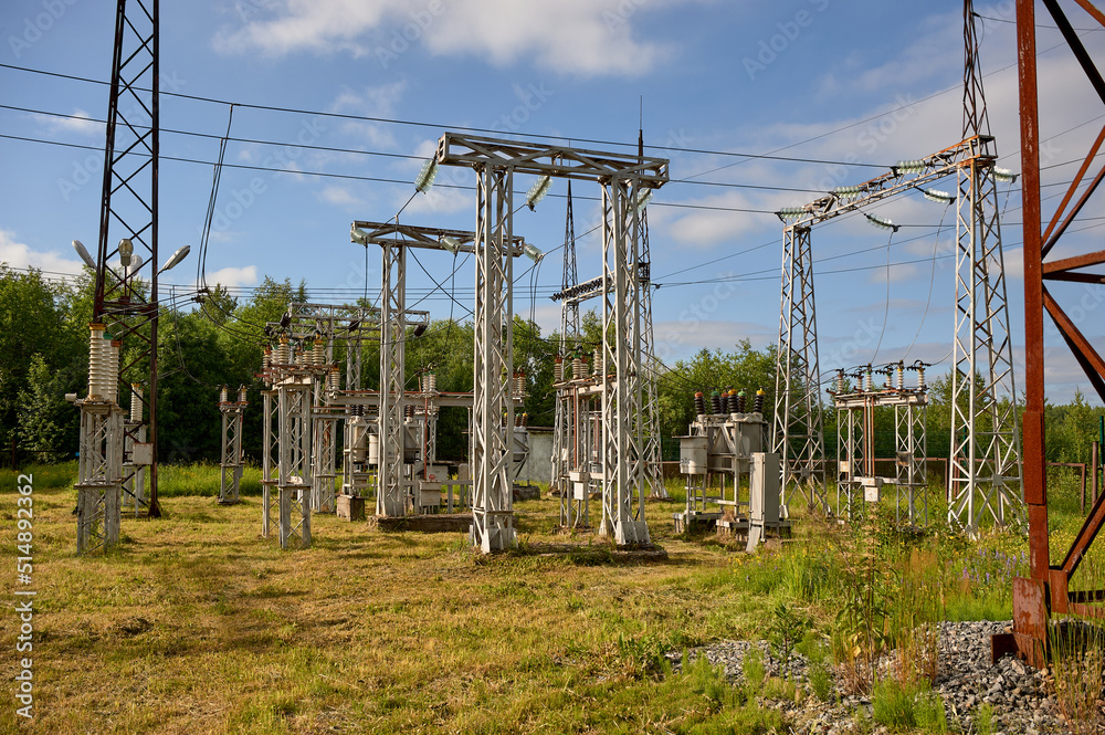 Fototapeta premium high-voltage electrical substation against the blue sky