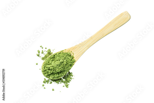 Green matcha tea powder isolated on a white background. Herbal matcha tea in a wooden spoon.