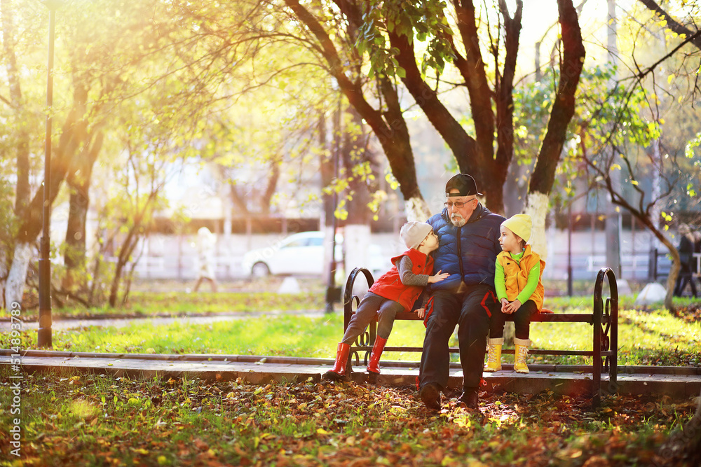Children walk in the autumn park Children walk in the autumn park
