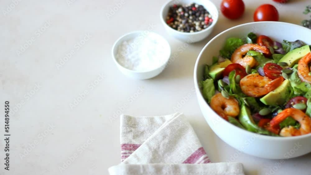Salad with shrimps, avocado, tomatoes, onions and seeds. Healthy eating. Diet. Salad with shrimps, avocado, tomatoes, onions and seeds. Healthy eating. Diet.