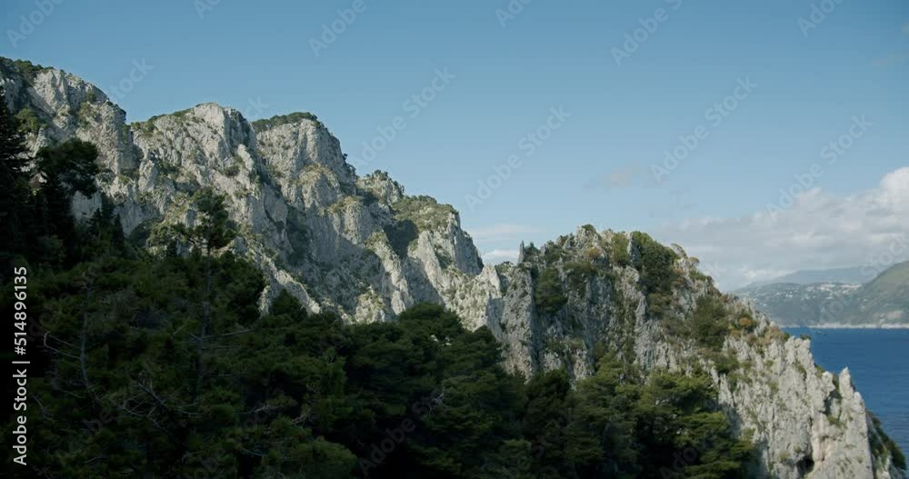 Beautiful view of some cliffs in the island of Capri, in Italy, during a sunny evening during spring Beautiful view of some cliffs in the island of Capri, in Italy, during a sunny evening during spring