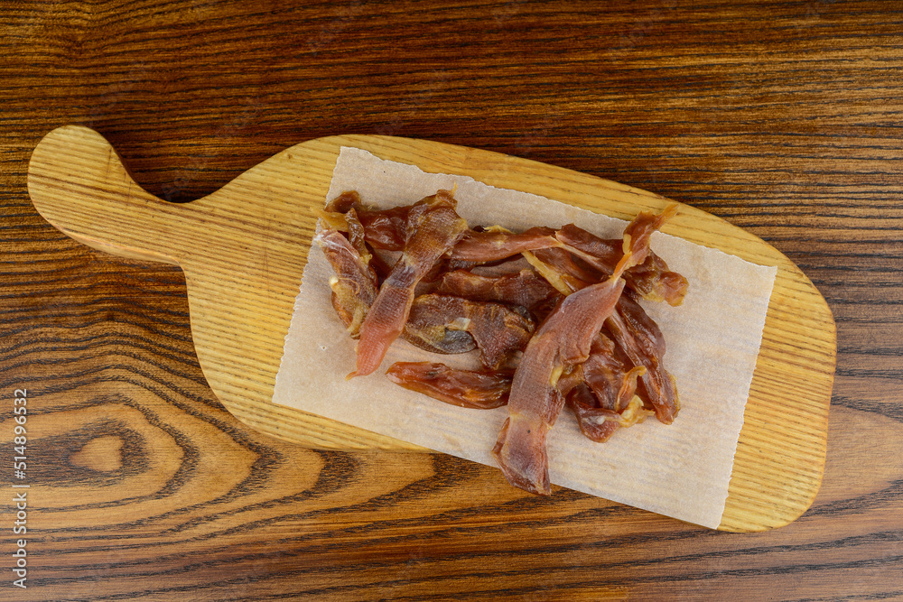 dried meat snack on a wooden board