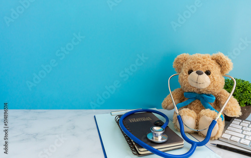Children doctor concept - Teddy Bear with stethoscope. copy space
