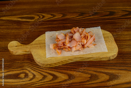 chicken jerky on a wooden board