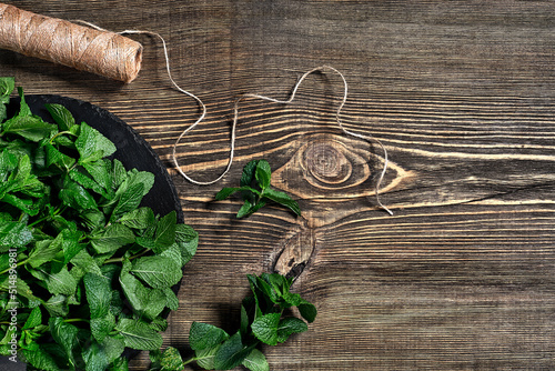 Fresh mint leaves on wooden background. Top view. Copy space