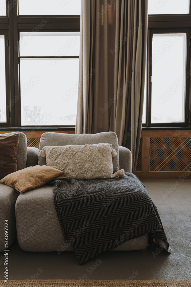 Elegant comfortable sofa couch with pillows, windows, curtains. Interior decoration details. Modern aesthetic minimalist home living room interior design. Luxury apartment interior Elegant comfortable sofa couch with pillows, windows, curtains. Interior decoration details. Modern aesthetic minimalist home living room interior design. Luxury apartment interior