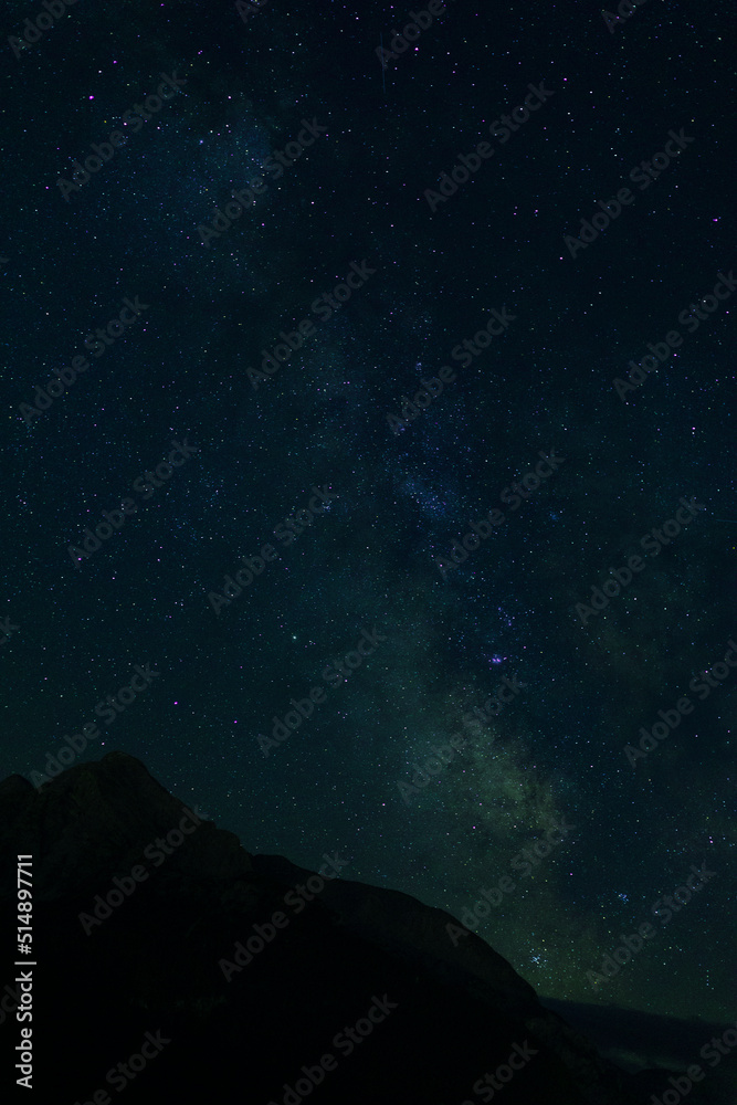 nightscape, night full of stars,  view at the mountain Hoher Goell, Berchtesgaden, Bavaria, Germany, and the Milkyway behind in the night sky