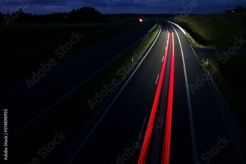 Night traffic on a motorway. Speed, colours, perspective
