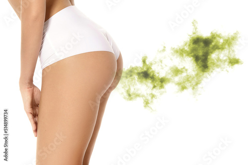 Young woman suffering from excessive flatulence photo