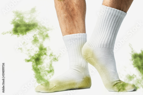 Male feet with smelly dirty socks photo