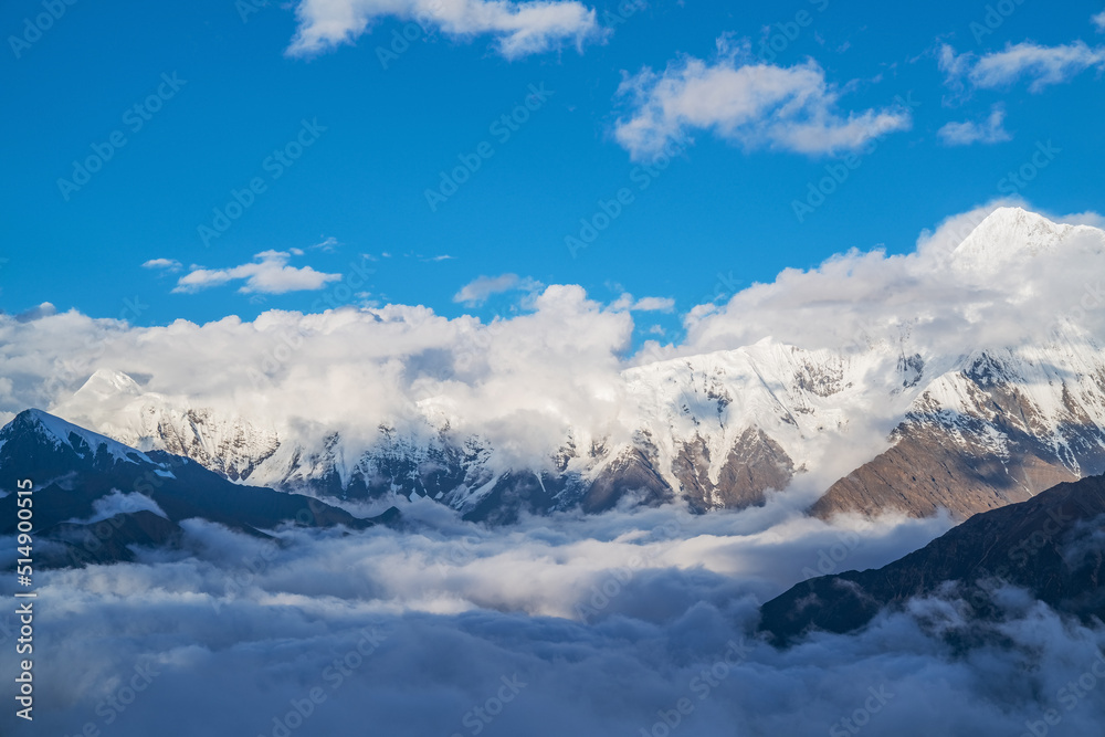 The natural beauty of Gongga snow mountain and blue sky and white clouds in Western Sichuan, China