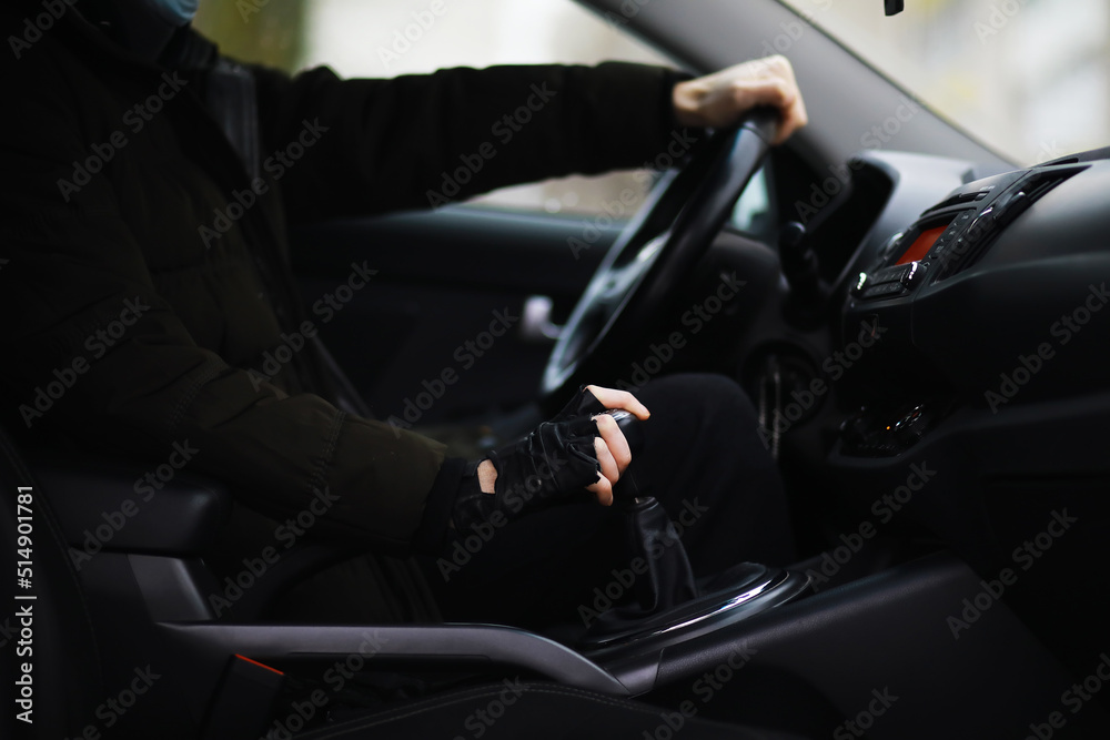 Hand on the car gear knob. The driver switches the speed in the car. Hand on gear lever. Hand on the car gear knob. The driver switches the speed in the car. Hand on gear lever.