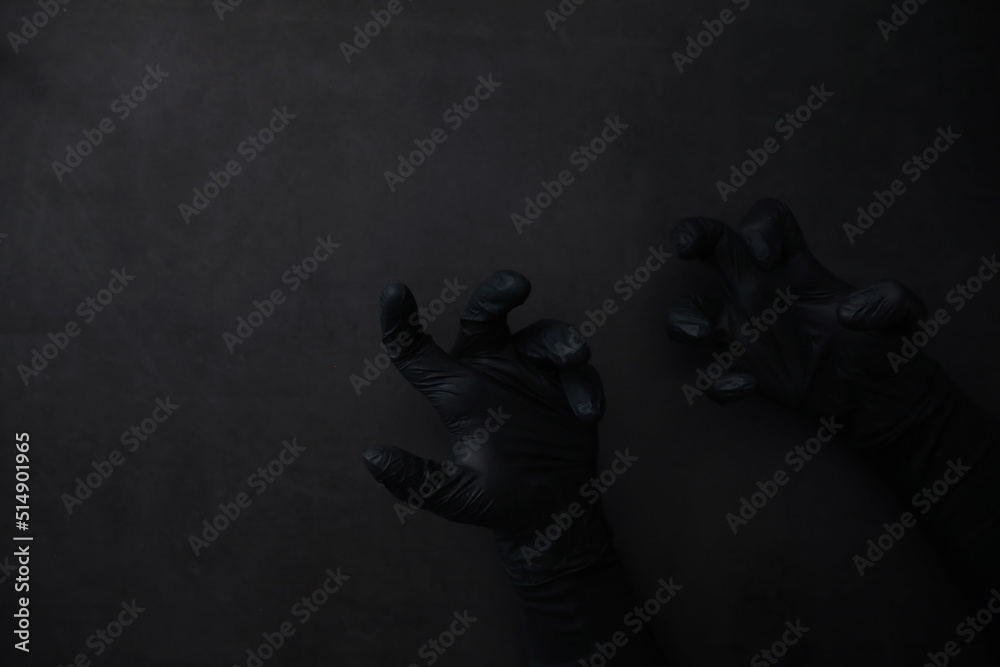 Background of hands in gloves. Black gloves. Hand gestures in black gloves.