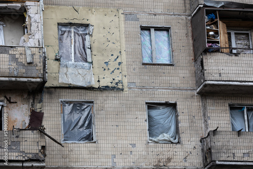 KYIV, UKRAINE - APR 21, 2022: The facade of an apartment building on Koshytsia str. was destroyed by the Kalibr cruise missile on the second day of the full-scale Russian invasion of Ukraine. photo
