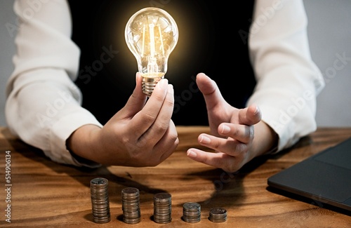 saving coins idea with light bulb for investment Concept idea and innovation.