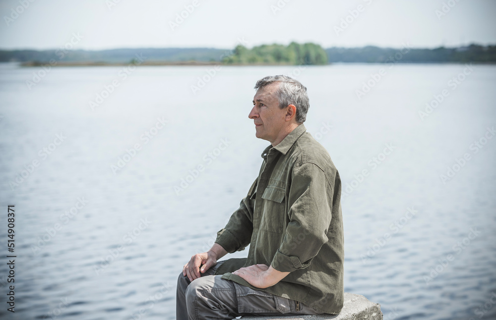 Psychology portrait of mature man, outdoor scene, concept of crisis, problems in life Psychology portrait of mature man, outdoor scene, concept of crisis, problems in life