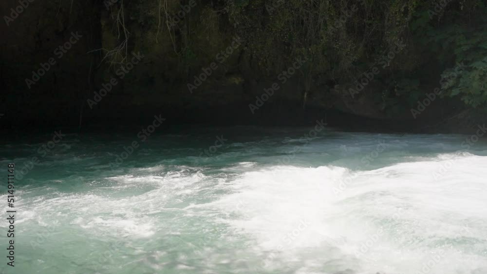 The mountain river. The vines plastered the rock. Water flies through the air. Summer, sunny day. Slow mo. The mountain river. The vines plastered the rock. Water flies through the air. Summer, sunny day. Slow mo.
