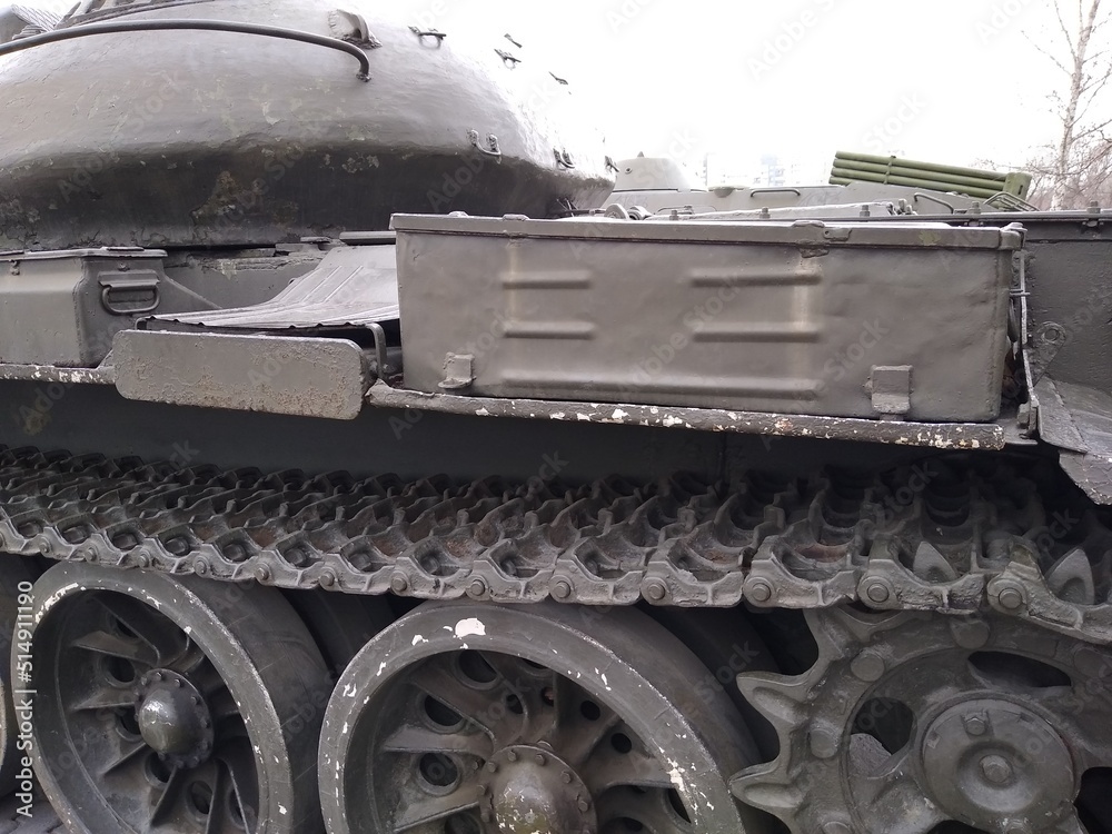 Military equipment, a close-up battle tank on a tracked track