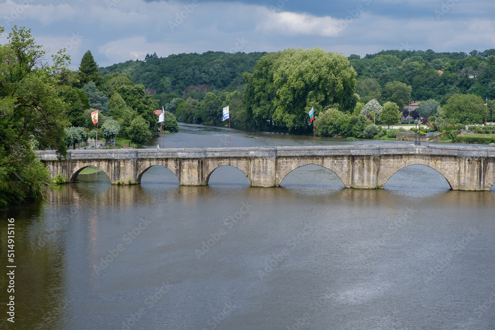 Old stone bridge across Charente river in Confolens, Charente, Poitou-Charentes, Aquitaine, France
