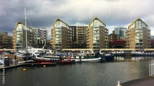 Docklands light rail train passes across Limehouse Basin near Isle of Dogs in East London photo