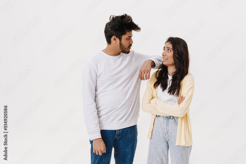 East asian young man and woman posing at camera together East asian young man and woman posing at camera together