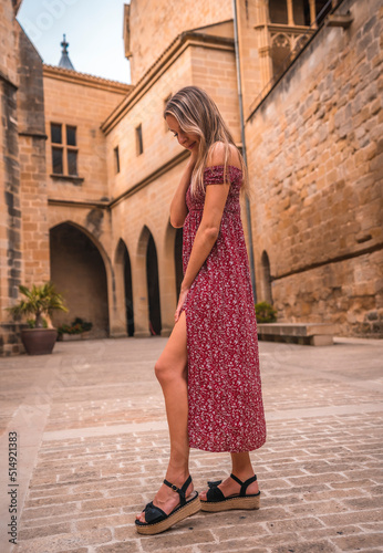 Portrait of a blonde woman in a medieval castle  enjoying the holidays