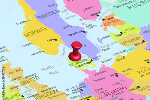 Denmark with red fastener pushpin on europe map, close up Denmark, travel idea, colorful map with location icon, vacation concept