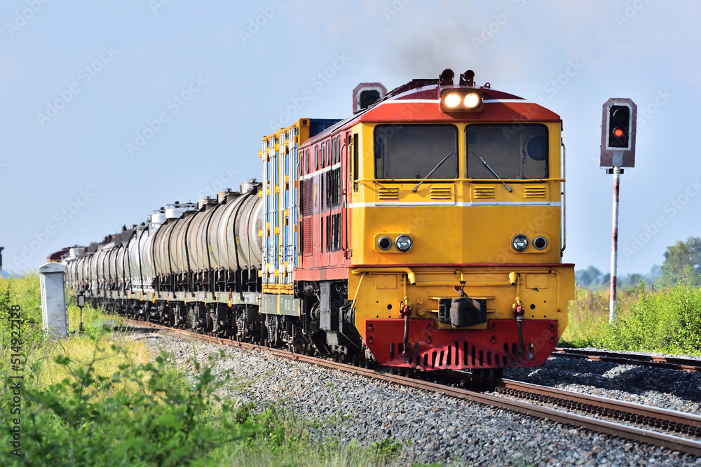 Thai tanker freight-train by diesel locomotive on the railway.