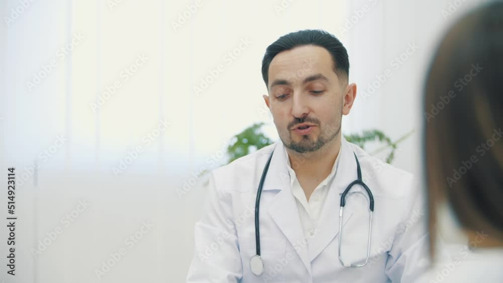 4k slow motion video of doctor wearing white lab coat holding explaining. 4k slow motion video of doctor wearing white lab coat holding explaining.
