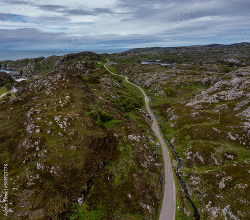 coastal road on the North Coast 500 scenic drive in the Scottish Higlands near Lochniver photo