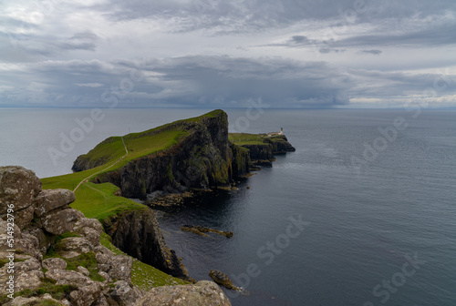 view of Neist Point on the Minch and the lighthouse on the cliffs photo