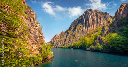 Adorable summer view of Matka Canyon with tourists on kayak. Gorgeous morning scene of North Macedonia, Europe. Traveling concept background.