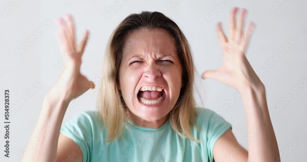 Portrait of angry emotionally nervous screaming woman