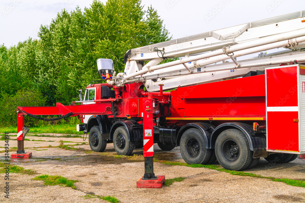 Fototapeta premium Fire truck for extinguishing tanks with air-mechanical foam. A fire truck for extinguishing tanks with flammable liquids. Fire truck for extinguishing large fires at oil refining plants.
