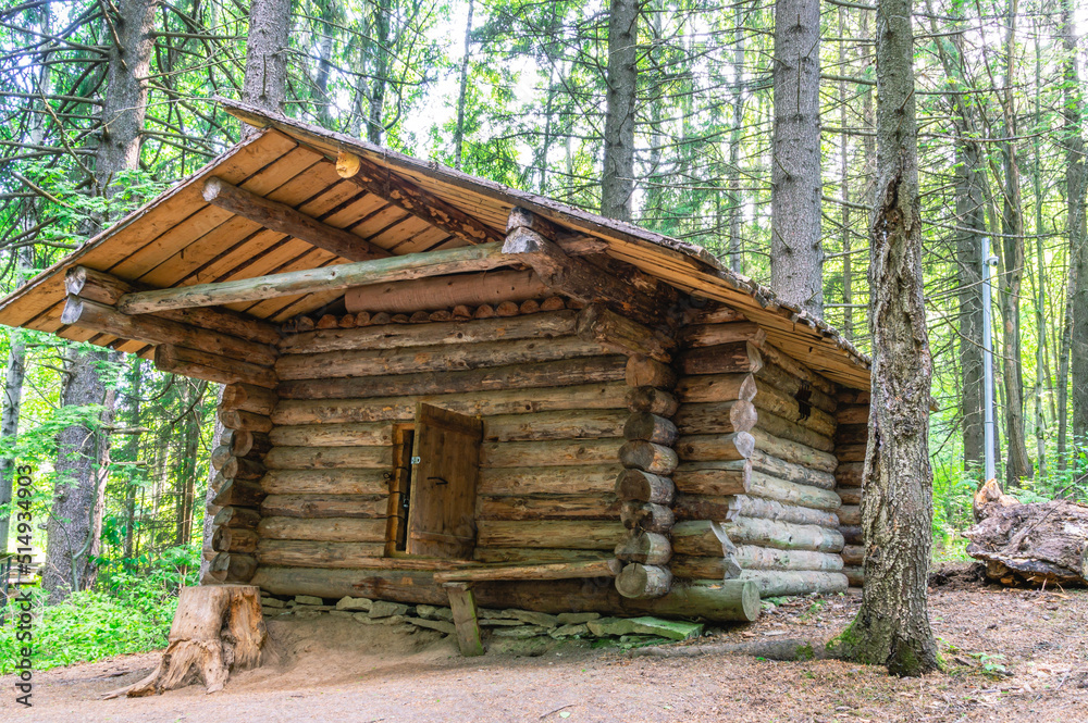 Hunting for the purpose of production and sale of hunting goods in the last century. A hunting lodge in the forest for a hunter's pastime. An old wooden hunting lodge built in the 19th century. Hunting for the purpose of production and sale of hunting goods in the last century. A hunting lodge in the forest for a hunter's pastime. An old wooden hunting lodge built in the 19th century.