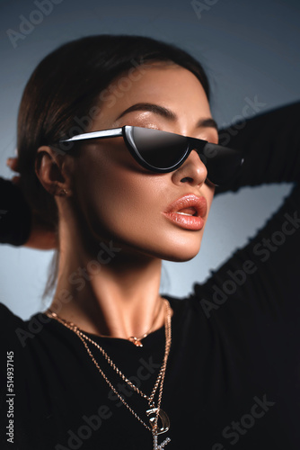 Sunglasses advertising. Closeup girl with sun glasses. Fashion trendy style woman. Beautiful female model © Mironifamily