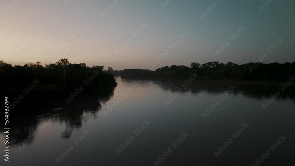 Serenity Of Nature With Silhouettes On Jungle River In The Amazon Of Ecuador. Aerial Drone Shot Serenity Of Nature With Silhouettes On Jungle River In The Amazon Of Ecuador. Aerial Drone Shot