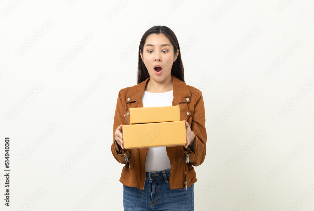 Young excited beautiful asian woman with many parcel cardboard standing on isolated white background. Cheerful female holding lot of parcel box receive from the delivery service Young excited beautiful asian woman with many parcel cardboard standing on isolated white background. Cheerful female holding lot of parcel box receive from the delivery service