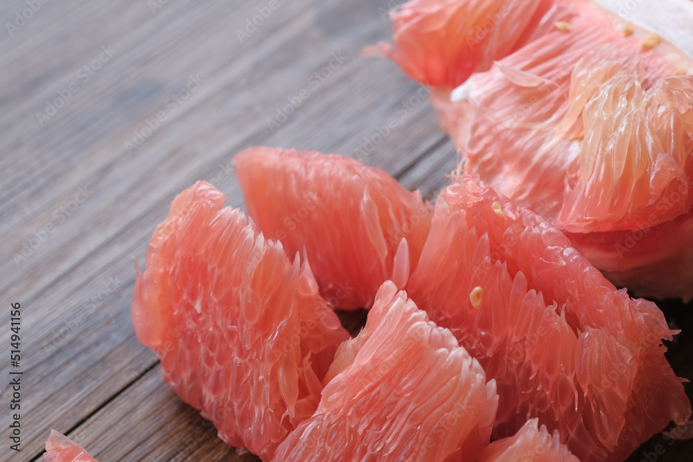 Fresh red pomelo fruit or grapefrui on wooden background Fresh red pomelo fruit or grapefrui on wooden background